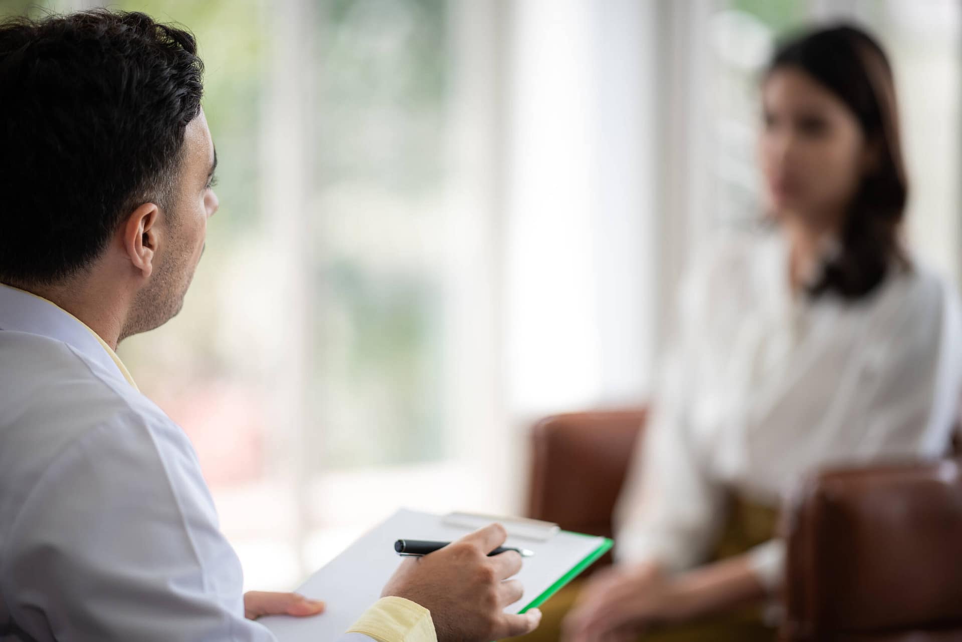 Mental health concept, Close-up of psychologist comforting his depressed patient, Doctor (psychiatrist) consultation and diagnostic examining woman patient Mental health concept, Close-up of psychologist comforting his depressed patient, Doctor (psychiatrist) consultation and diagnostic examining woman patient