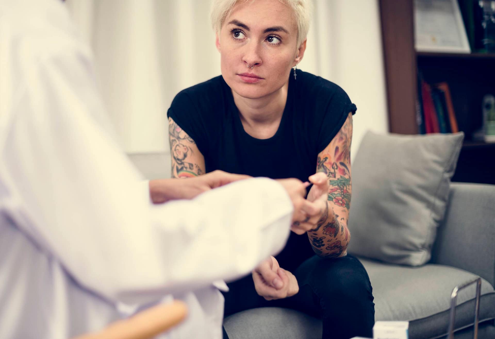 Depressed woman having a counseling session Depressed woman having a counseling session